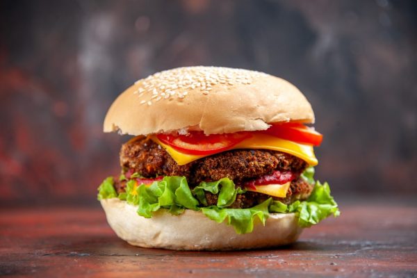 front-view-tasty-meat-burger-with-cheese-salad-dark-background-min